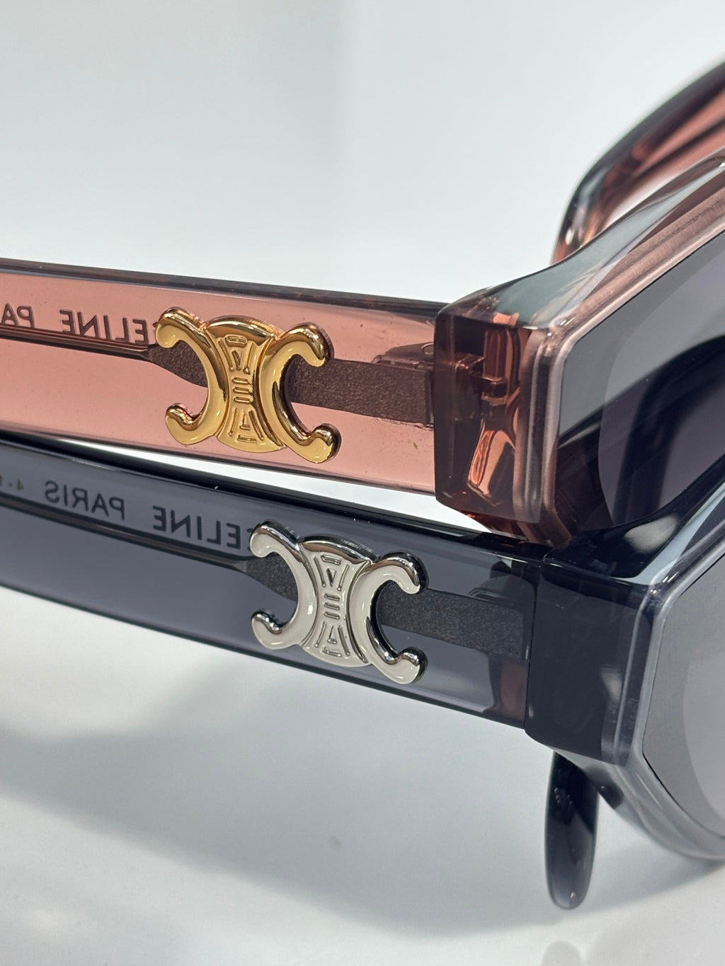 Celine sunglasses temple detail with gold and silver logo on dark frame