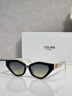 Celine cat-eye sunglasses with black frames and gold logo at the temple