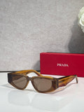 Prada glasses with brown tortoiseshell frames and tinted lenses, front view