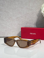 Prada glasses with brown tortoiseshell frames and tinted lenses, front view