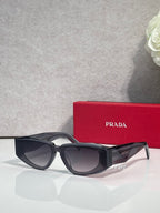 Prada glasses with dark frames and tinted lenses, angled side view