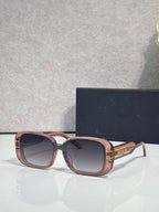 Dior sunglasses with rose gold square frames and dark tinted lenses
