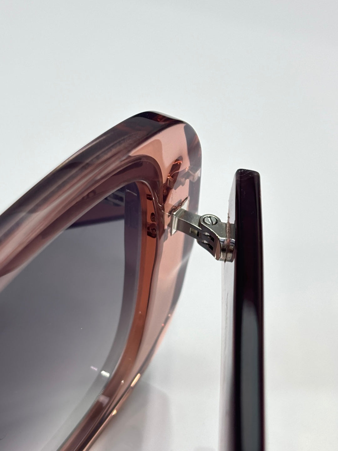 Dior sunglasses close-up of rose frame hinge and metal arm