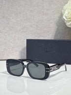 Dior sunglasses with black square frames and dark tinted lenses
