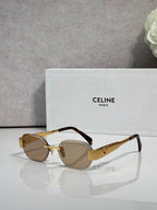 Celine sunglasses with tortoiseshell frames and dark lenses, gold-tone hinge details