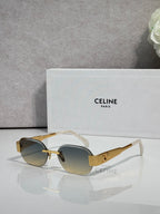Celine sunglasses with gold-beige frames, dark lenses, and clear-style temple tips