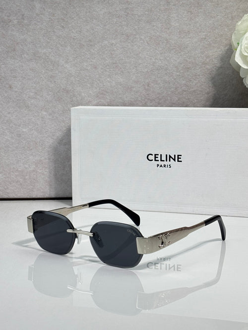 Celine sunglasses with black frames, dark lenses, and gold-tone logo on the temples