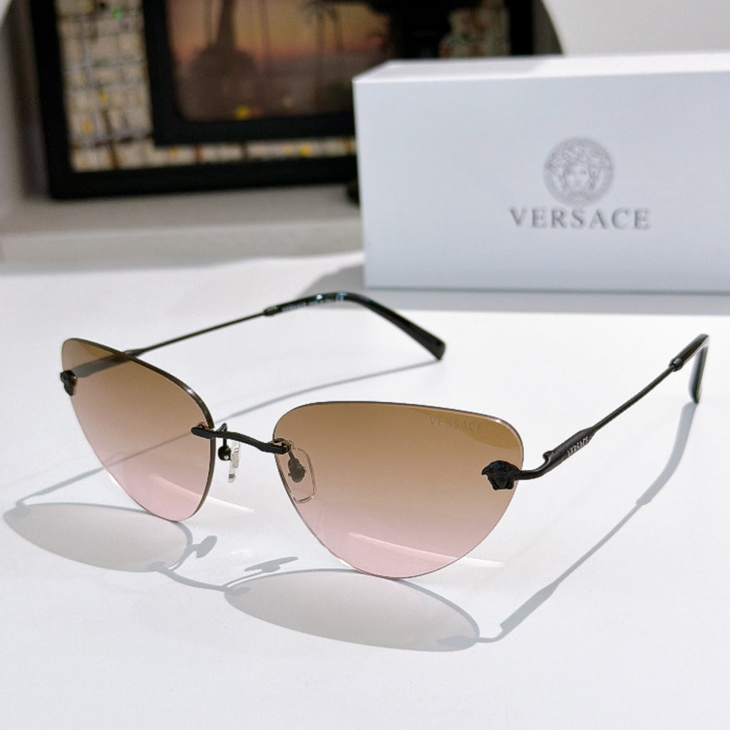Versace sunglasses with light pink-tinted lenses and dark frame, cat-eye style