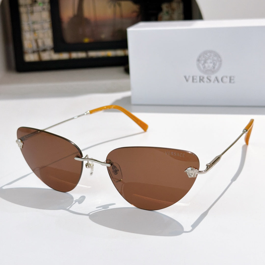 Versace sunglasses with brown lenses and silver frame, orange temple accents