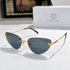 Versace sunglasses with blue lenses and gold frame, tortoise temple accents