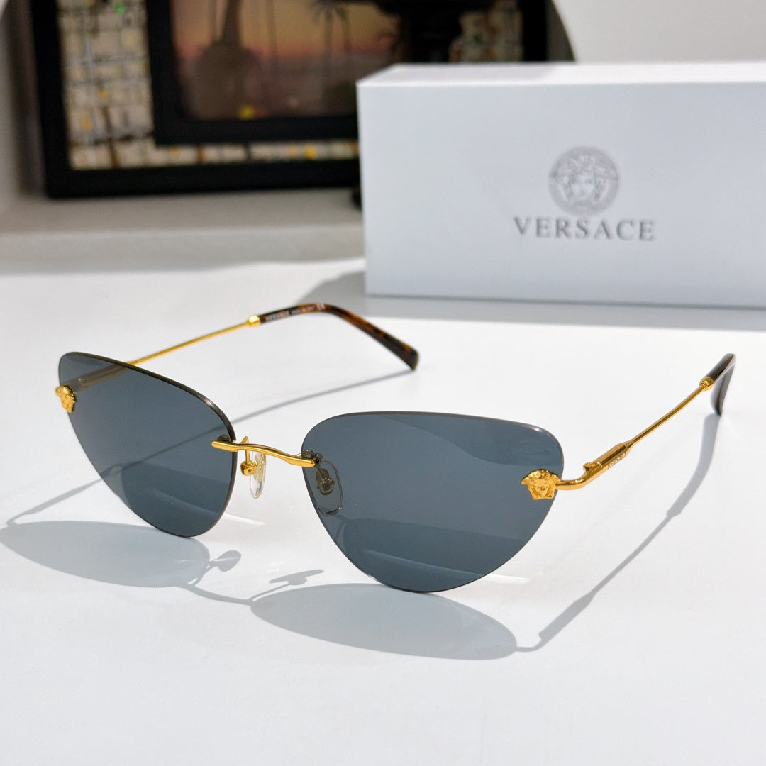 Versace sunglasses with blue lenses and gold frame, tortoise temple accents
