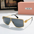 MiuMiu aviator sunglasses with gold frame and dark blue lenses, gold logo temples.