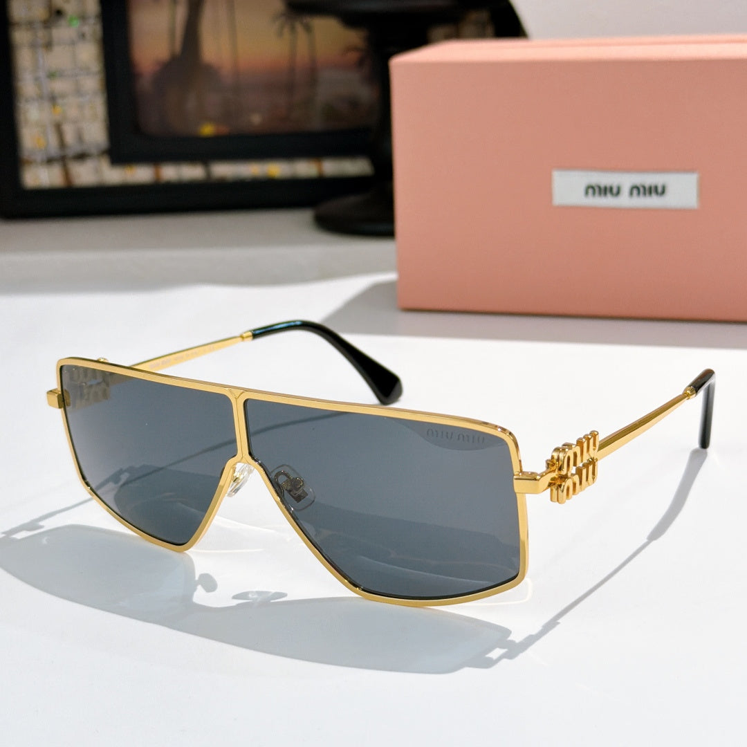 MiuMiu aviator sunglasses with gold frame and dark blue lenses, gold logo temples.