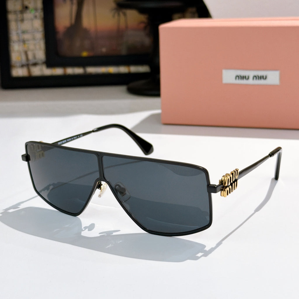 MiuMiu aviator sunglasses with dark frame, blue-tinted lenses, and gold logo temples.