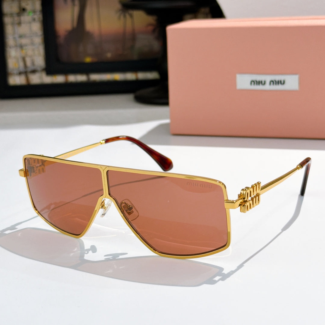 MiuMiu aviator sunglasses with gold frame and amber-tinted lenses, tortoise temple accents.