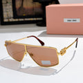 MiuMiu aviator sunglasses with gold frame, rose-tinted lenses, and gold logo temples.