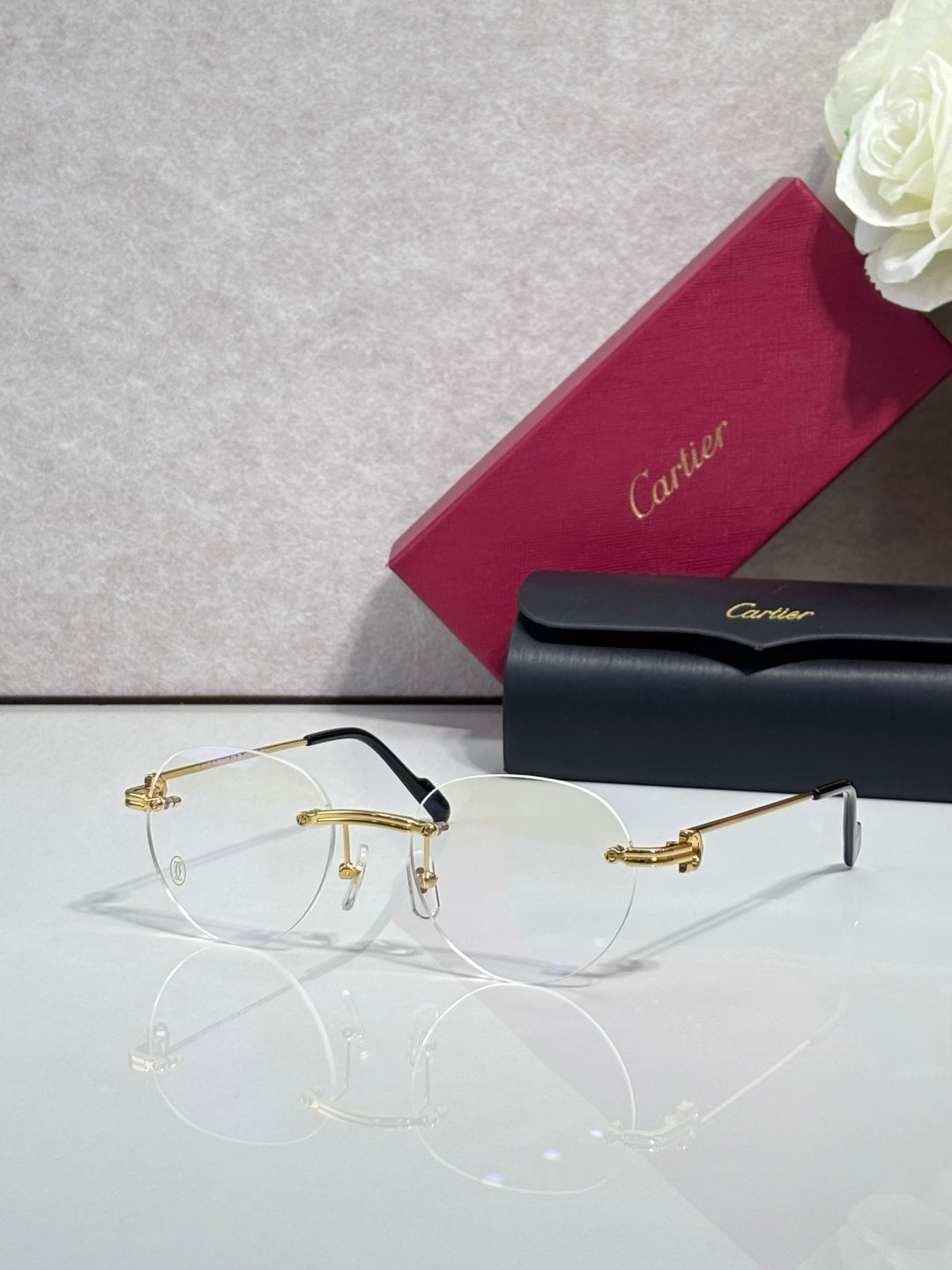 Metal eyeglasses with clear lenses, gold frame and thin black nose bridge