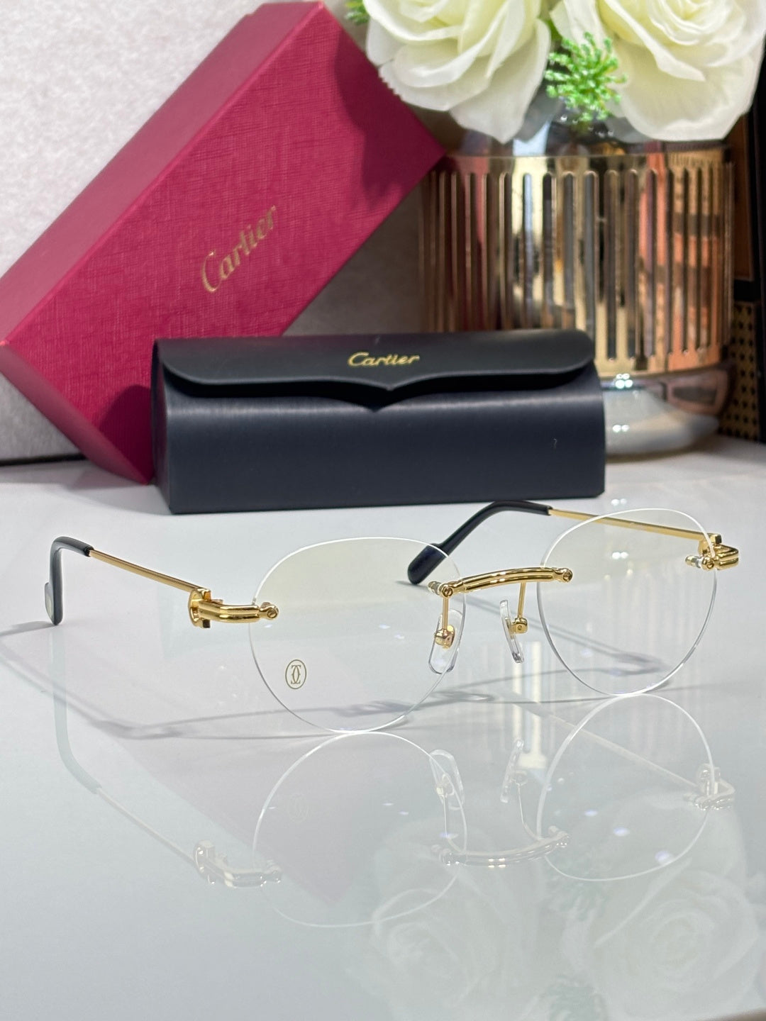 Gold-rim eyeglasses with clear lenses and slim metal temples