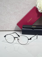 Cartier eyeglasses, round clear lenses, thin dark frame with black temple arms