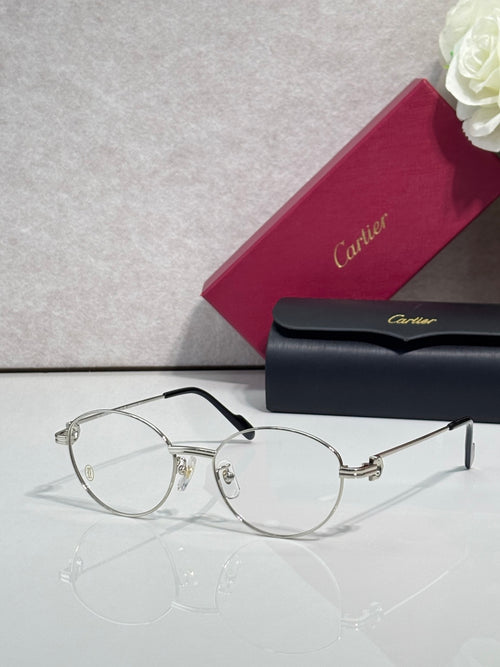 Cartier eyeglasses, round clear lenses, thin black frame with gold hinge details