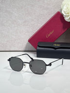Cartier sunglasses with black metal frame and dark gray round lenses