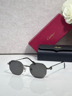 Cartier sunglasses with silver metal frame and dark gray round lenses