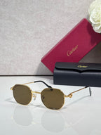Cartier sunglasses with gold metal frame and brown-tinted round lenses
