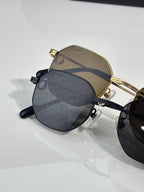 Cartier sunglasses close-up with tinted lenses and gold metal top bar