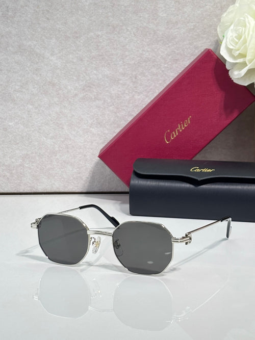 Cartier sunglasses with silver metal frame and dark gray round lenses