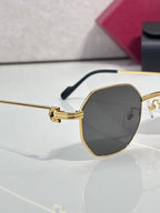 Cartier oval sunglasses with gold-tone frame and dark tinted lens, side view