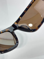 Celine tortoiseshell sunglasses close-up of curved arm and tinted lenses