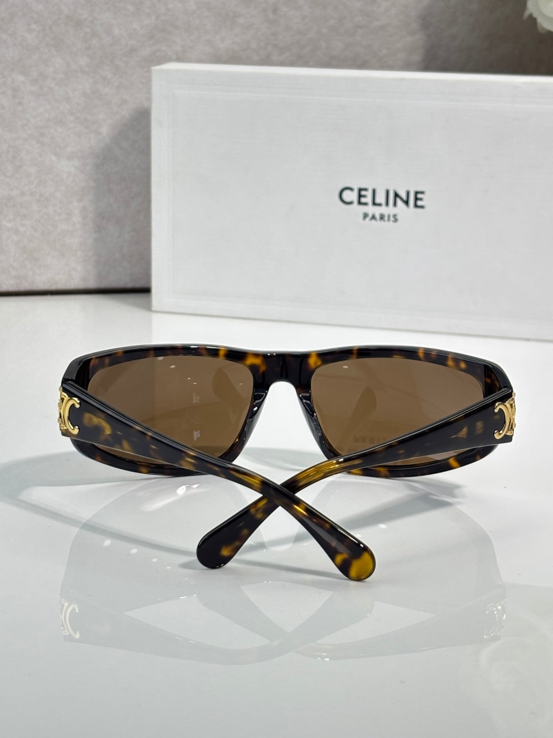 Celine tortoiseshell sunglasses with dark brown lenses and gold accents