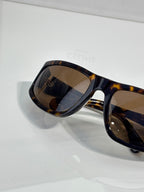 Celine tortoiseshell sunglasses side view with dark tinted lenses
