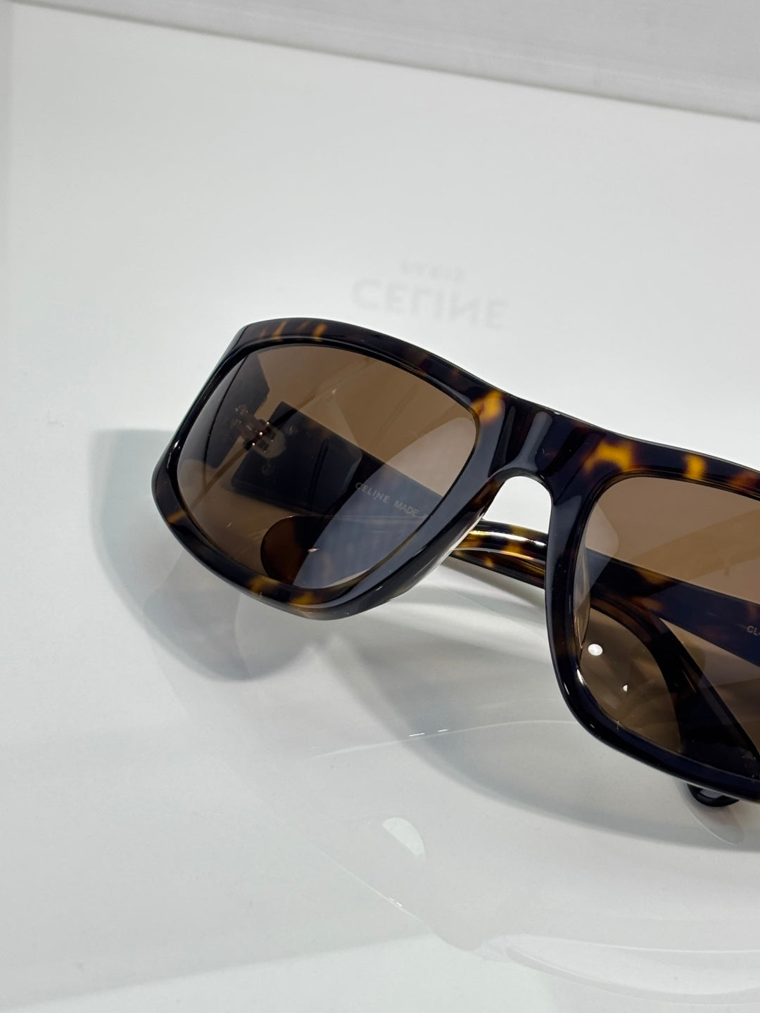 Celine tortoiseshell sunglasses side view with dark tinted lenses