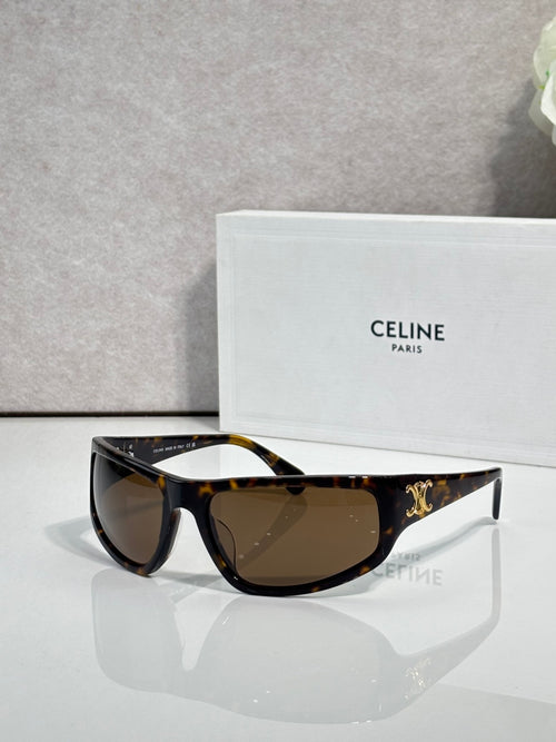 Celine tortoiseshell sunglasses with dark brown lenses and gold logo on temple