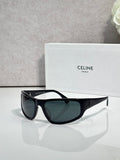 Celine sunglasses with dark frames and tinted dark green lenses, classic cat-eye shape
