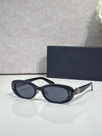 Dior black oval sunglasses with dark blue-gray lenses