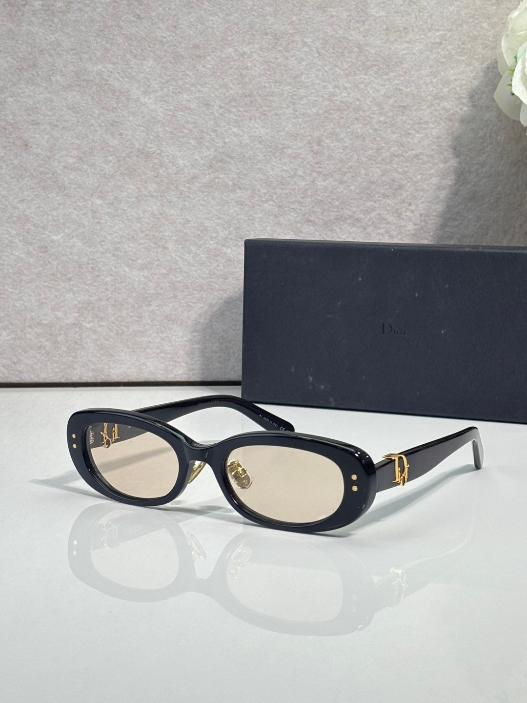 Dior black oval sunglasses with beige lenses and gold-tone detail