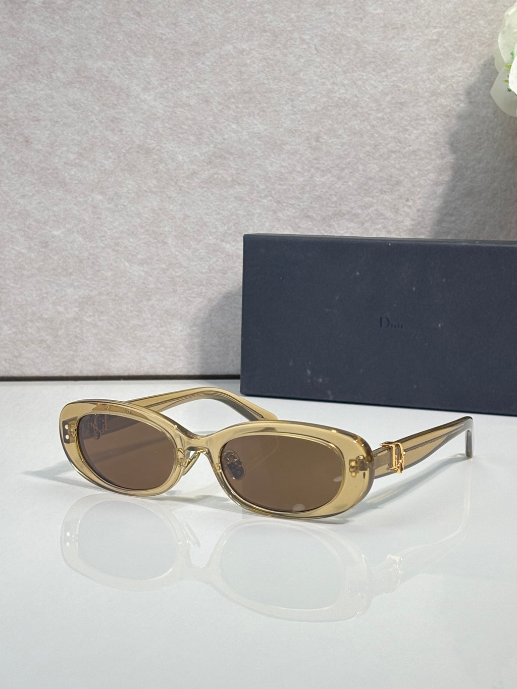 Dior gold oval sunglasses with dark brown lenses