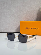 Louis Vuitton glasses with black frames and dark gradient lenses, gold logo temples