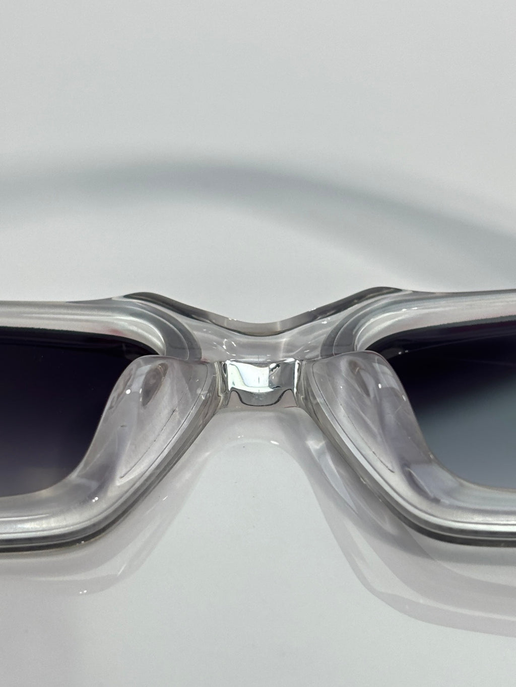 Clear front sunglasses with dark gradient lenses and metal bridge