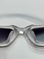 Clear front sunglasses with dark gradient lenses and metal bridge