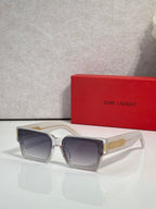 Square clear sunglasses with dark lenses and gold-tone bridge accents