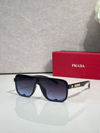 Prada dark rectangular sunglasses with tinted lenses and thick black frame