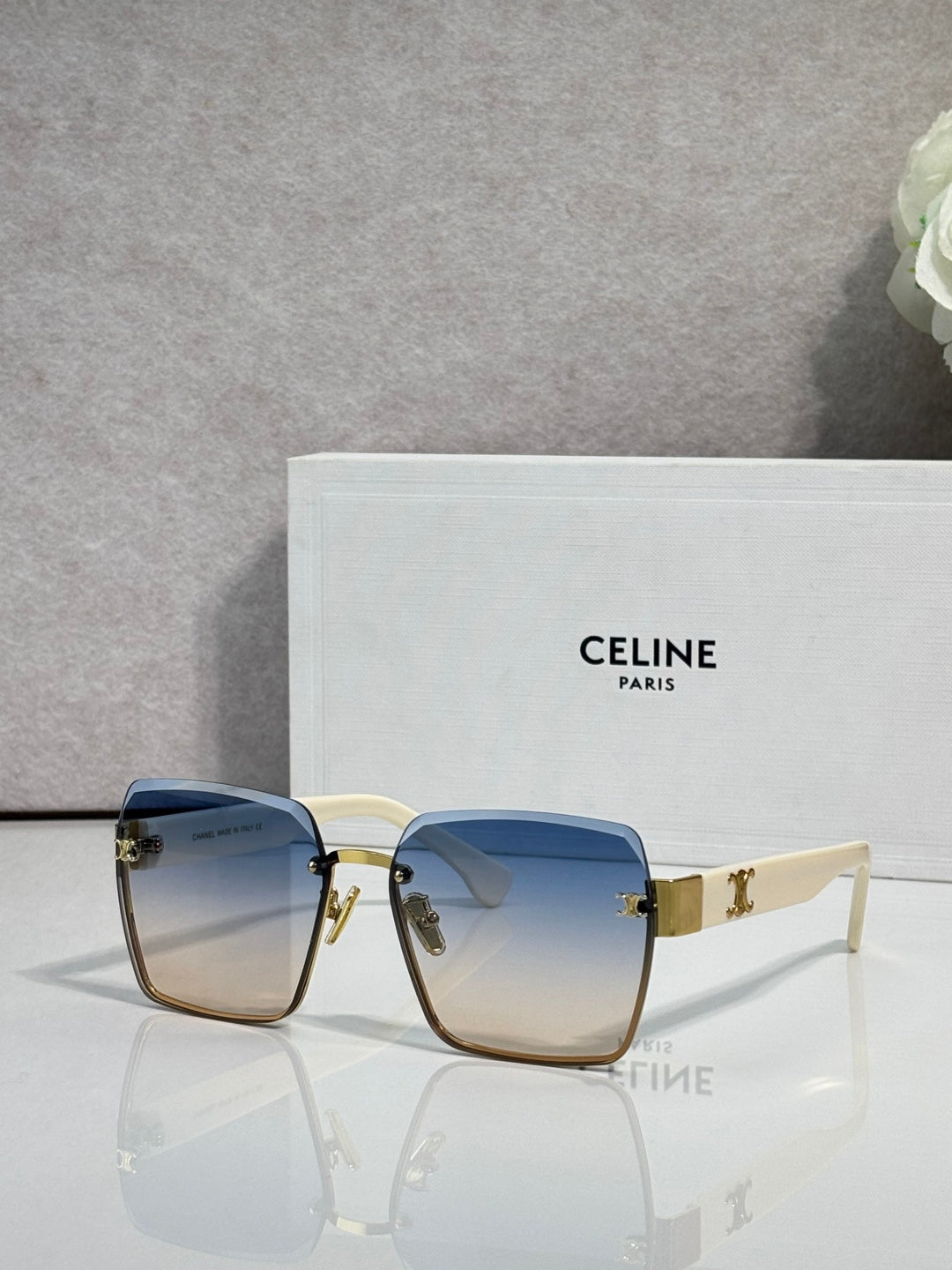 Celine square sunglasses with gold-tone frame and blue gradient lenses