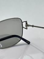 Gucci sunglasses close-up of temple with GUCCI marking and dark lenses