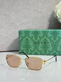 Gucci sunglasses with gold frame and light brown tinted lenses