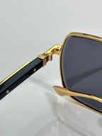 Cartier sunglasses close-up of gold frame and black temple insert