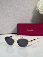 Gold-tone round sunglasses with dark gray lenses