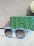 Gucci square sunglasses with light blue frame and dark lenses